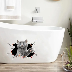 Detailed view of 3D grey cat wall sticker appearing from a hole on a white bathtub