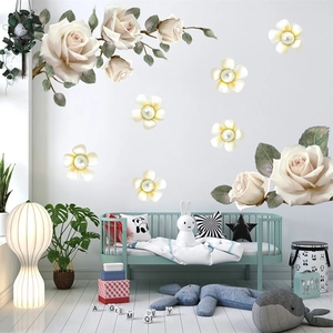 3D floral wall decal featuring white roses and pearls in a cozy mint green nursery
