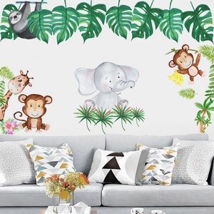 Jungle animal wall stickers with watercolor elephant and giraffe above a modern sofa