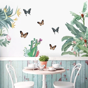 Tropical wall stickers featuring palm leaves and butterflies in a Nordic dining room scene
