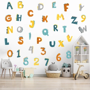 Colorful dinosaur themed alphabet and number wall decals in a bright child's bedroom setting