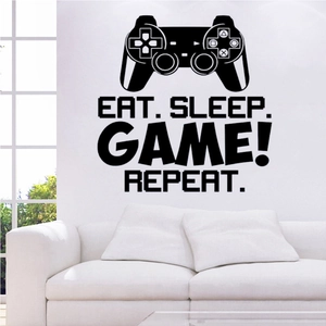 Detailed view of Eat Sleep Game Repeat wall decal with a controller silhouette on white wall