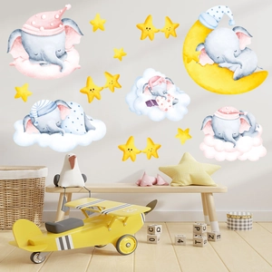 Detail view of cartoon elephant wall stickers with stars and moon in a nursery room