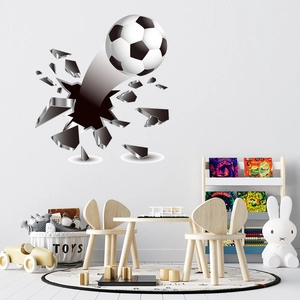 Detailed 3D wall sticker featuring a soccer ball crashing through a cracked wall effect
