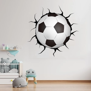 3D football wall decal showing realistic wall crack effect in a bright nursery setting