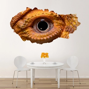 Close-up of 3D cracked wall sticker showing realistic yellow lizard eye and scales