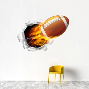 Adesivo murale 3D football americano con palla infuocata che rompe una parete bianca