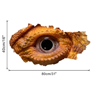 Detail view of 3D dinosaur eye wall sticker with realistic orange scales, 80cm width