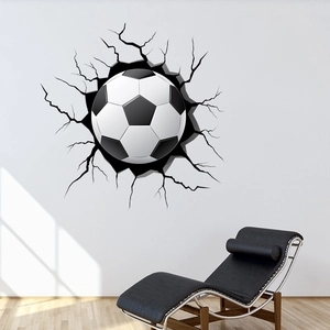 Macro detail of a 3D soccer ball wall decal with realistic black wall crack stickers