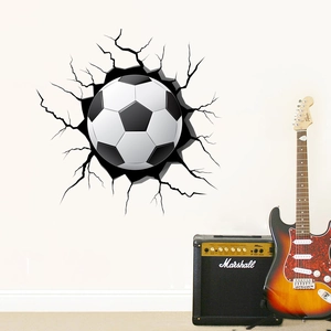 Detailed view of 3D cracked wall soccer ball vinyl sticker in a modern bedroom setting