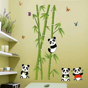 Detail of cute panda and bamboo wall stickers applied to a green nursery wall