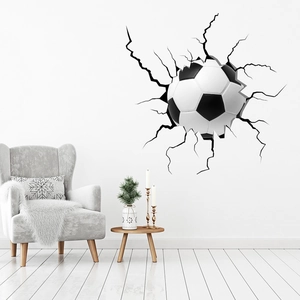 Detailed close-up of 3D cracked wall football sticker in a modern white living room