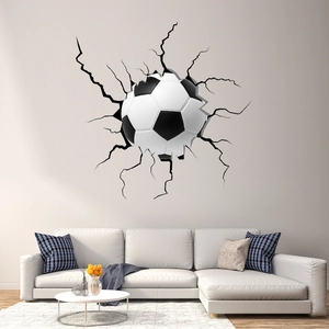Realistic 3D soccer ball wall sticker with crack effect in a minimalist living room