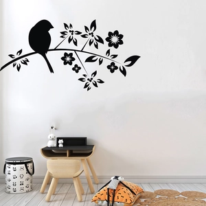 Detailed view of black bird and flowering branch wall sticker in a modern room