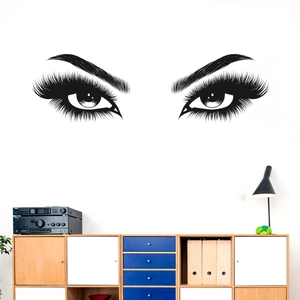 Detail of black vinyl eyelash wall decal showing high-gloss eye pattern and long lashes