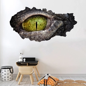 Detail of 3D cracked wall sticker showing a realistic green crocodile eye on a living room wall
