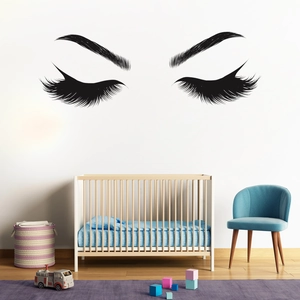 Detailed close-up of vinyl wall decal featuring elegant eyelashes and closed eyes design