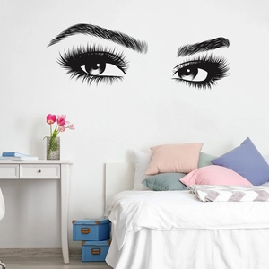 Detail of minimalist black eye lashes wall decal for modern bedroom decoration