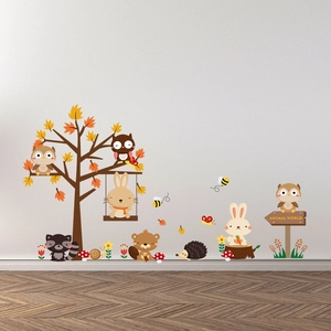 Detail of forest animal wall stickers with rabbits, owls and trees on a white wall