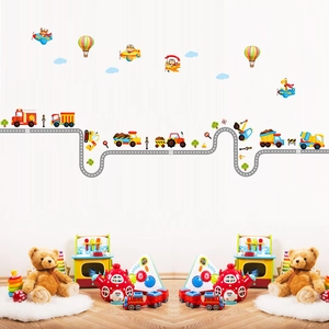 Detail of cartoon vehicle wall decals showing road and planes in a kids room setup