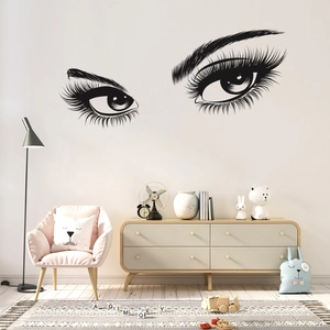 Detailed view of black eyelashes wall sticker in a modern cozy bedroom interior decor