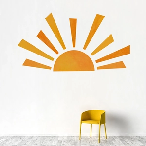 Minimalist sun wall decal in orange watercolor texture above a yellow modern chair