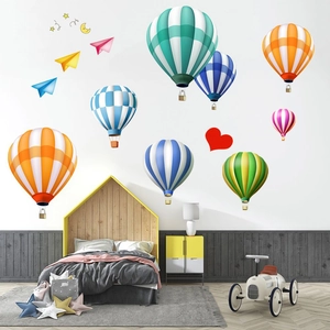 Hot air balloons and stars wall stickers applied on a modern nursery bedroom wall