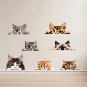 Detailed view of seven creative cat wall stickers on a minimalist beige home wall decor