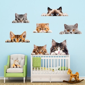 Detail of 3D cat wall stickers showing 7 realistic breeds on a light blue nursery wall