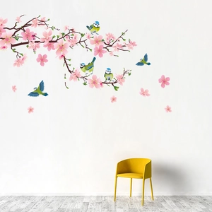 Detail of self-adhesive vinyl wall decal with pink cherry blossoms and colorful magpies