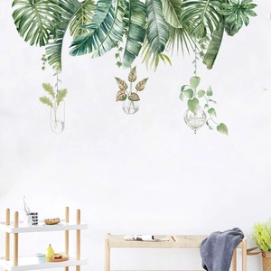 Sticker mural feuilles tropicales et vases suspendus pour une déco moderne et fraîche