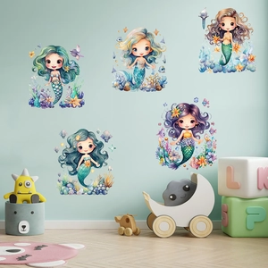 Detail of cute mermaid wall decals with colorful sea stars and coral in a kids bedroom