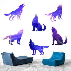 Set of 6 celestial wolf silhouette wall decals featuring blue nebula patterns on a white wall