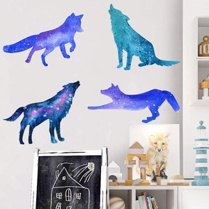 Detail of four starry sky wolf silhouettes for wall decor in a modern cozy room