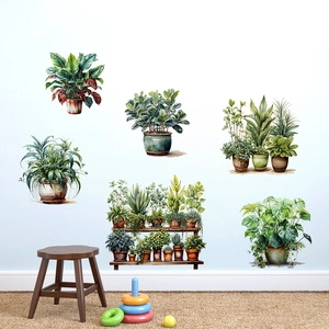 Detail of green leaf plant wall stickers on a white wall in a cozy room setting