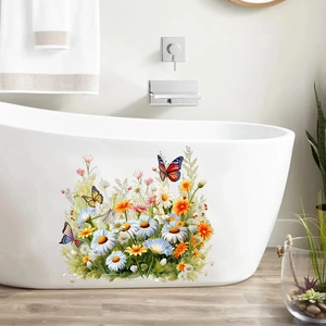 Sticker mural floral avec papillons et marguerites sur le côté d'une baignoire