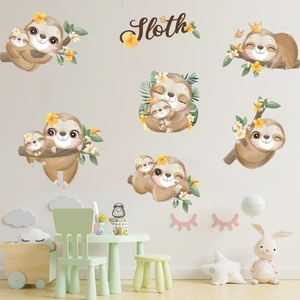 Detailed view of sloth wall decals with leaves and flowers on a grey wall decoration