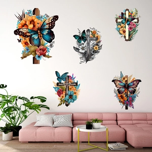 Vivid butterfly and flower cross wall decals displayed above a pink sofa in a cozy room