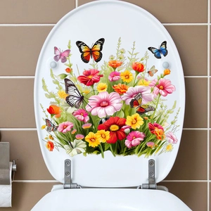 Vue détaillée des stickers autocollants fleurs et papillons colorés sur un abattant WC
