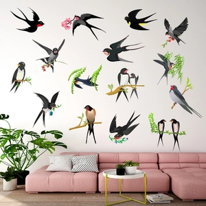Detail of bird and floral branch wall decals in a modern minimalist living room setting