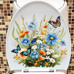 Sticker floral avec papillons colorés sur un abattant de WC blanc dans une salle de bain