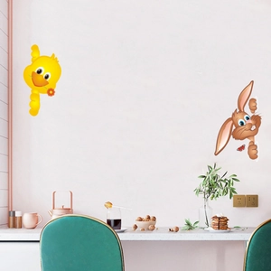 Detailed view of yellow duck and brown rabbit wall stickers in a modern dining area