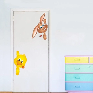 Peeking bunny and yellow duck wall decals on a white door for kids room decor