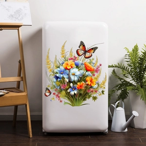 Détail des stickers muraux papillons et fleurs colorés posés sur un réfrigérateur blanc