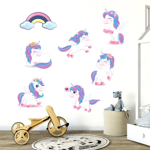 Detailed view of white unicorn wall stickers and rainbow decals in a kids' nursery room
