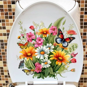 Gros plan de stickers autocollants papillons et fleurs colorés sur un abattant de WC