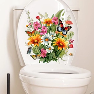 Gros plan de stickers autocollants de fleurs et papillons sur un couvercle de toilette