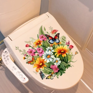 Détail des autocollants de tournesols et papillons sur le couvercle des toilettes