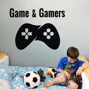 Detail of black vinyl Game & Gamers wall decal with controller design in a boy's bedroom