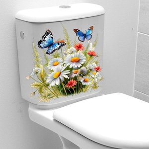 Détail des stickers WC fleuris avec des marguerites et des papillons bleus sur fond blanc